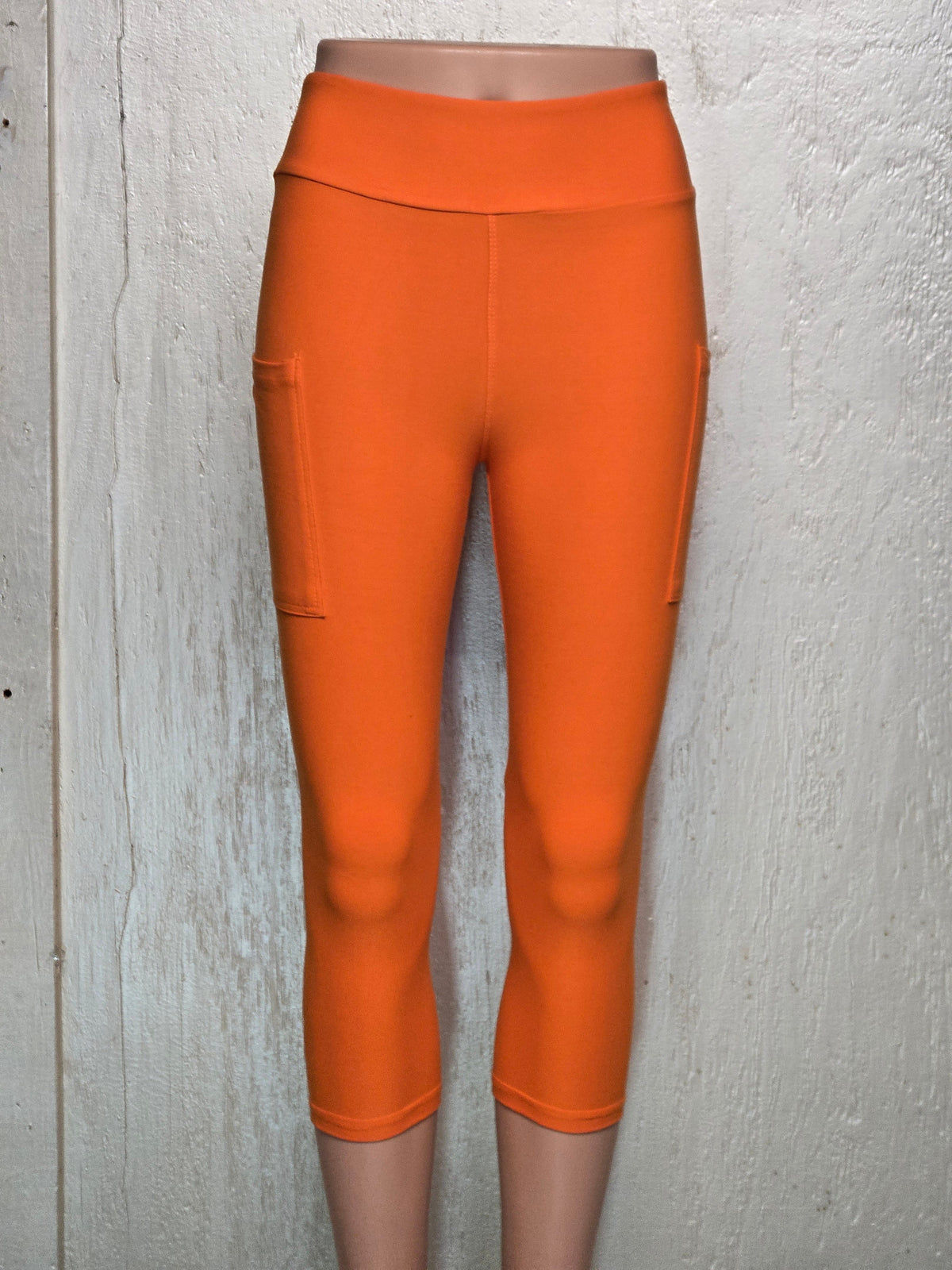 Orange capris and biker shorts with pockets